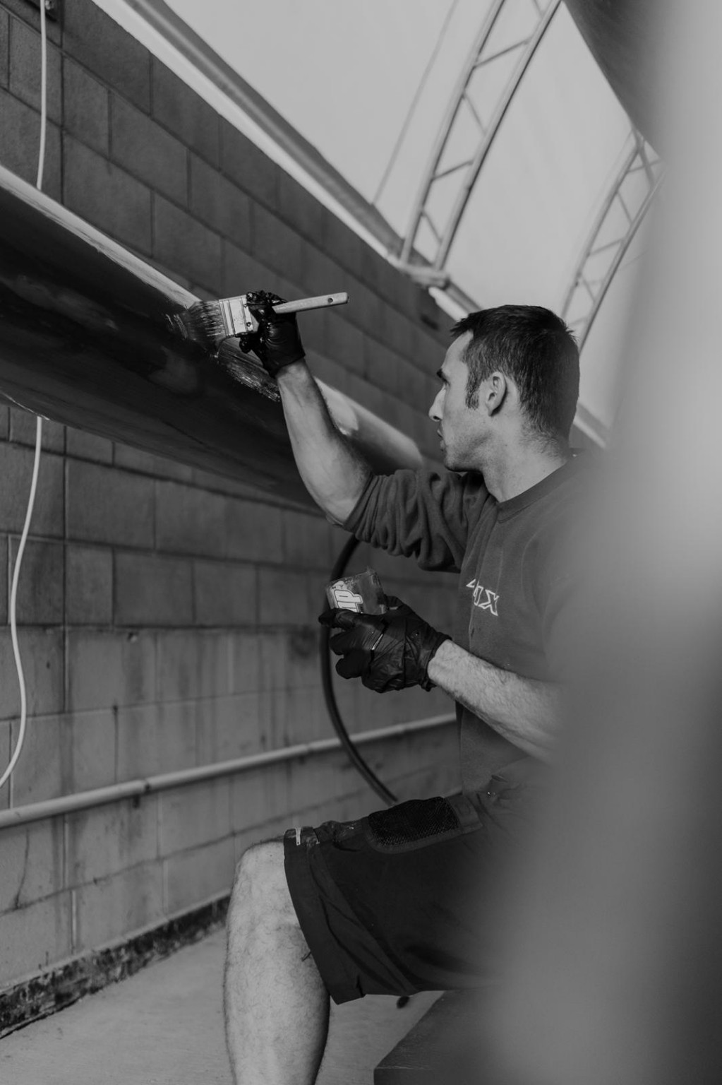 Samuel Gaudin Solanes carrying out yacht varnishing work