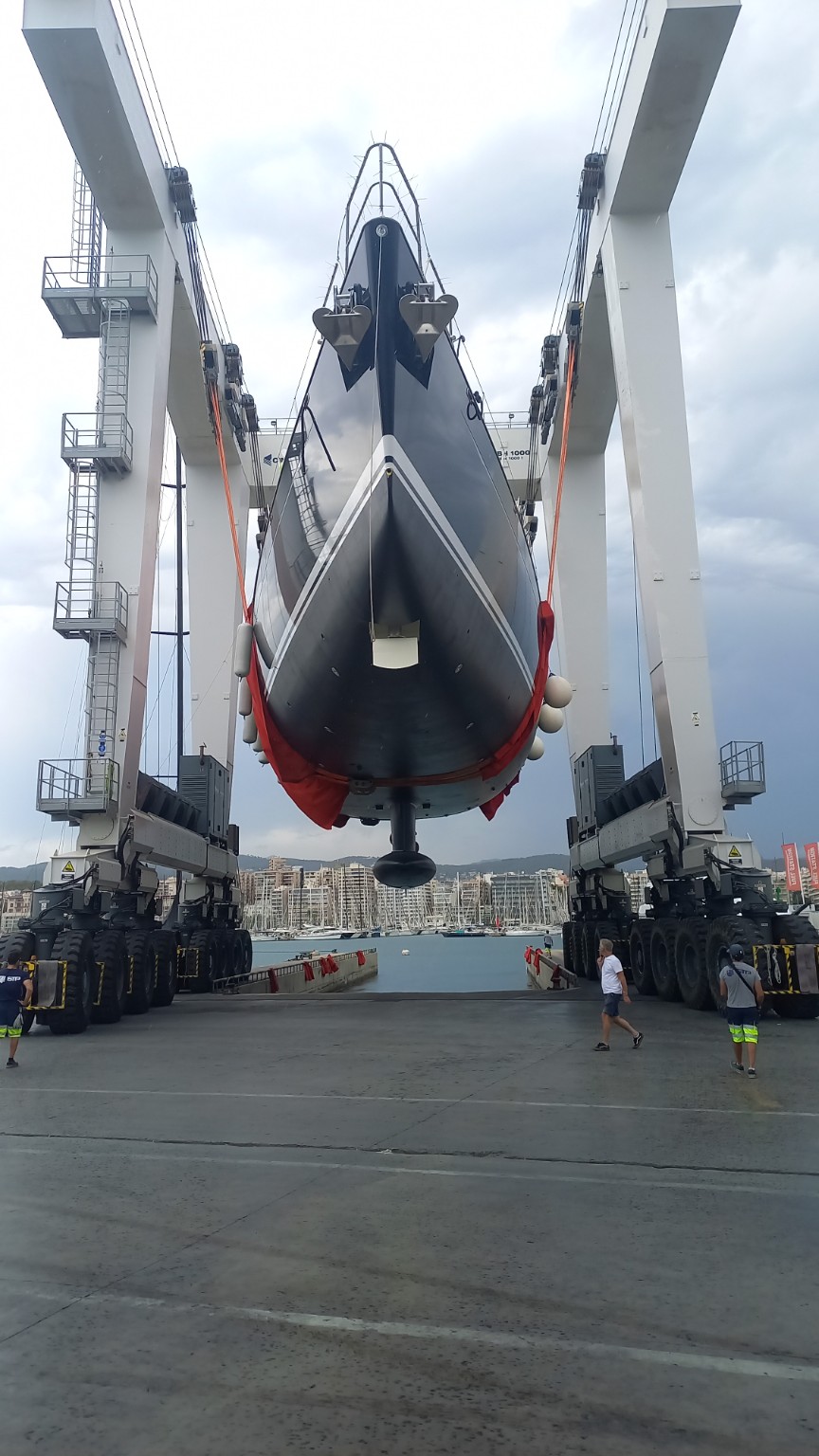 Yacht being lifted at a shipyard